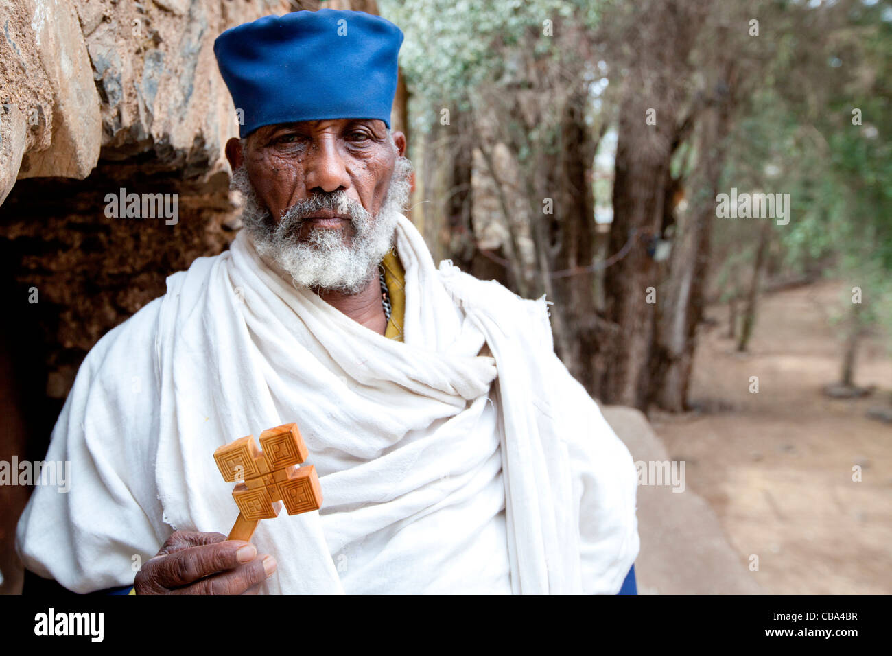 Orthodox Christian priest at the gate-house of Debre Berhan Selassie Church in Gonder, Northern Ethiopia, Africa. Stock Photo