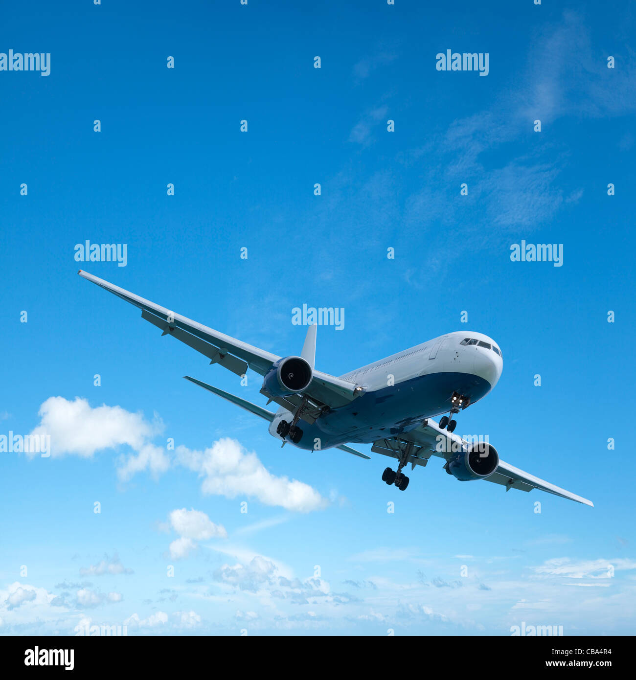 Jet aircraft is maneuvering for landing. Square composition with a lot of copy space.  Stock Photo