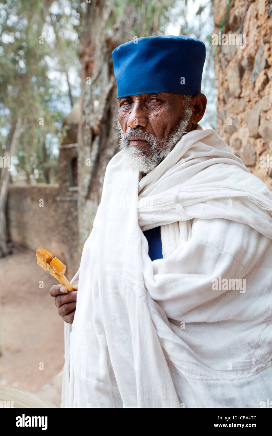 Orthodox Christian priest at the entrance gate of Debre Berhan Selassie Church in Gonder, Northern Ethiopia, Africa. Stock Photo