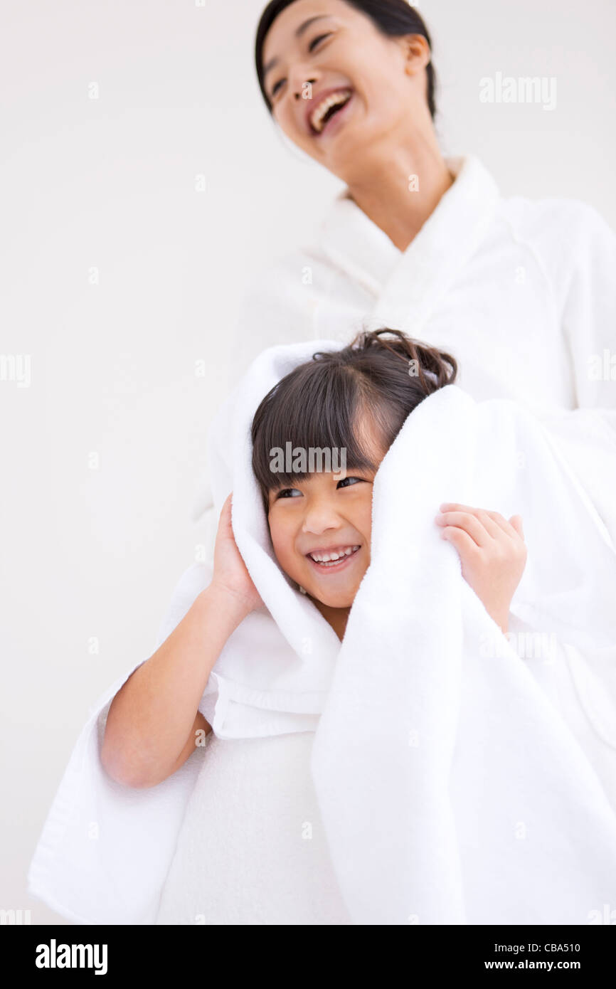 Mother wiping daughter's hair Stock Photo Alamy