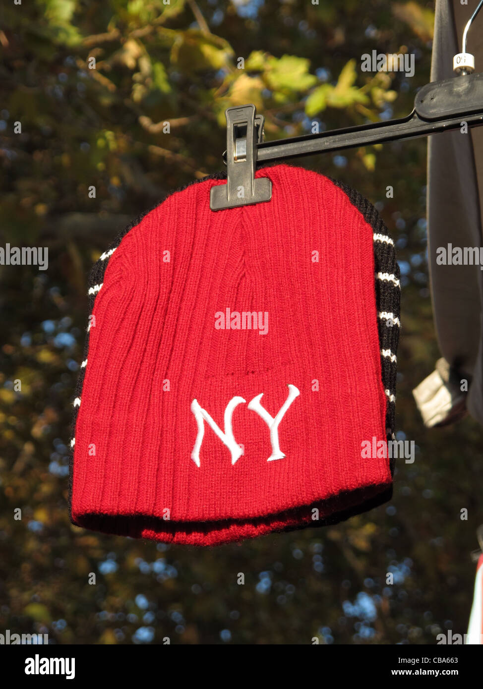 new york cap hat for sale on market stall stand in rome italy Stock