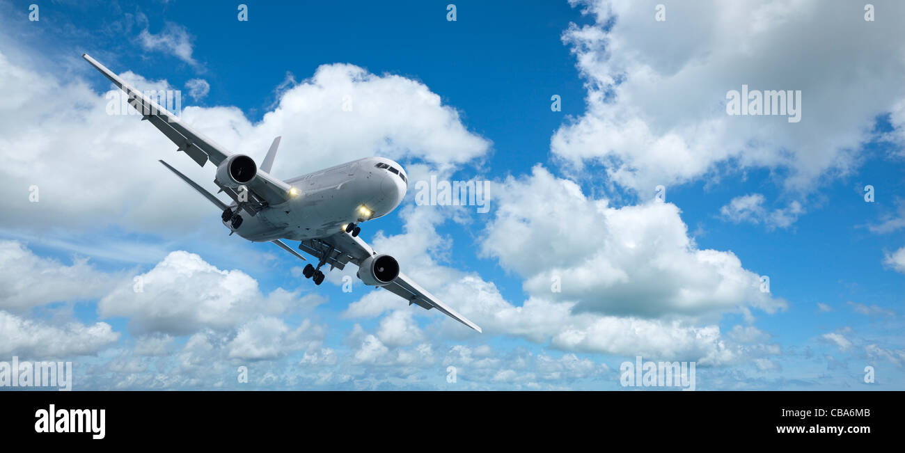 Jet aircraft is maneuvering for landing. Panoramic composition in high resolution. Stock Photo