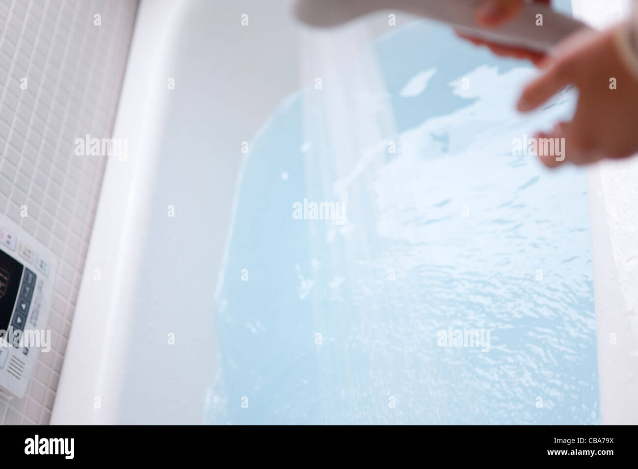 Woman Showering Water to Bathtub Stock Photo Alamy