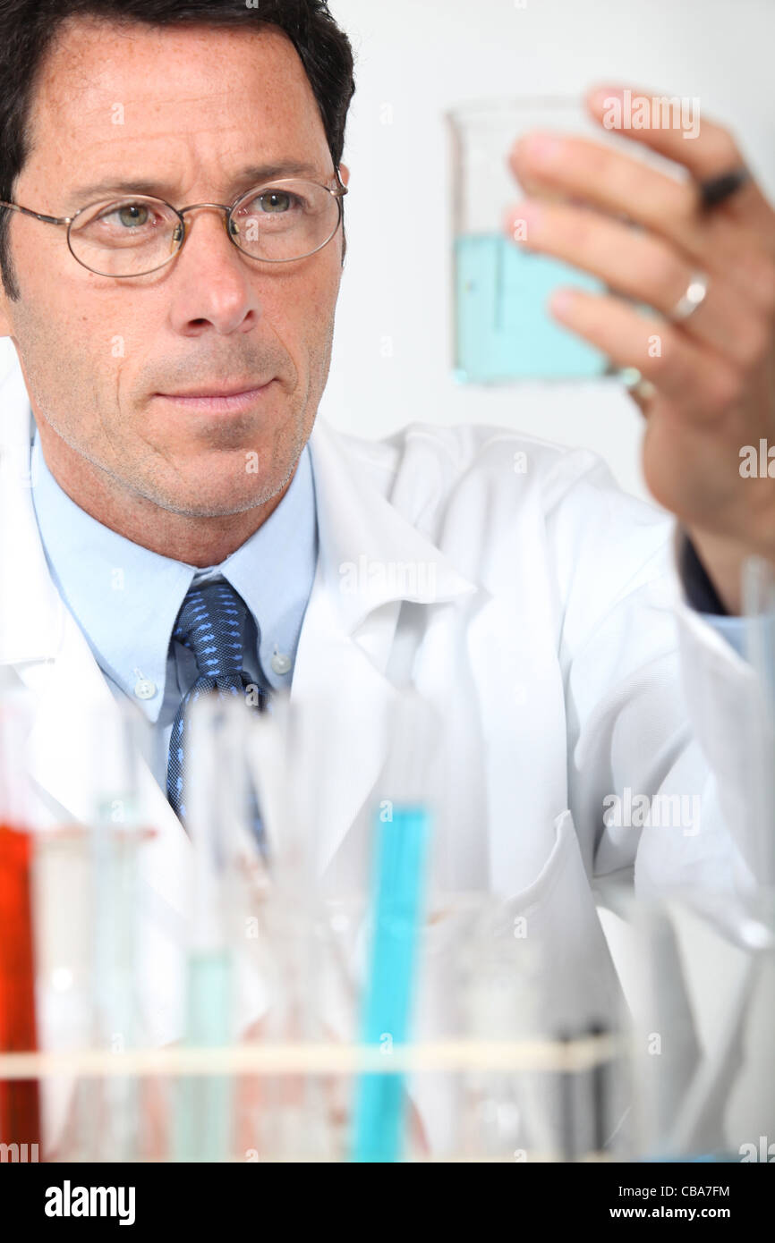 Male scientist holding glass beaker Stock Photo Alamy