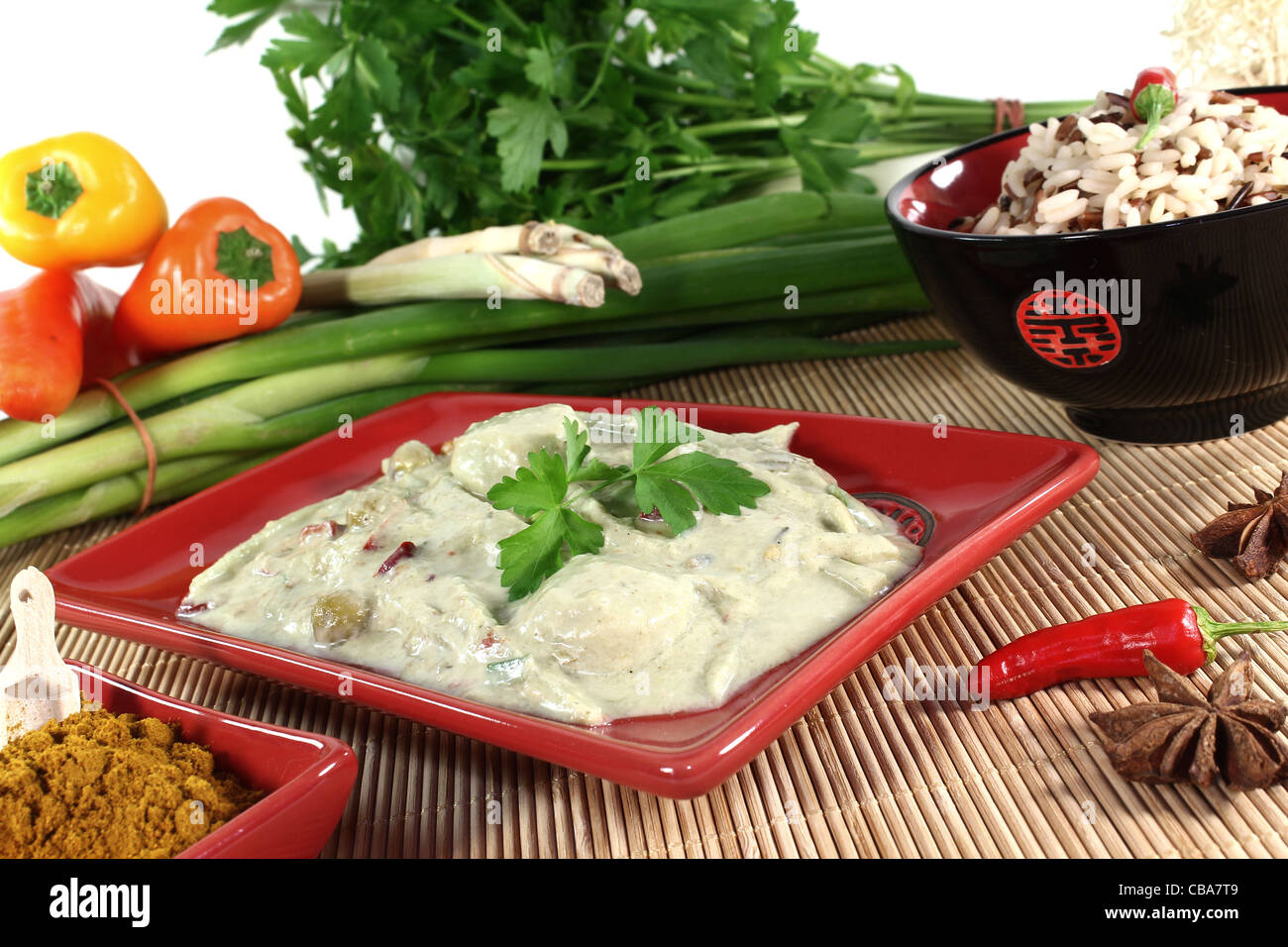 Indian green curry with wild rice, chilli and bamboo shoots Stock Photo