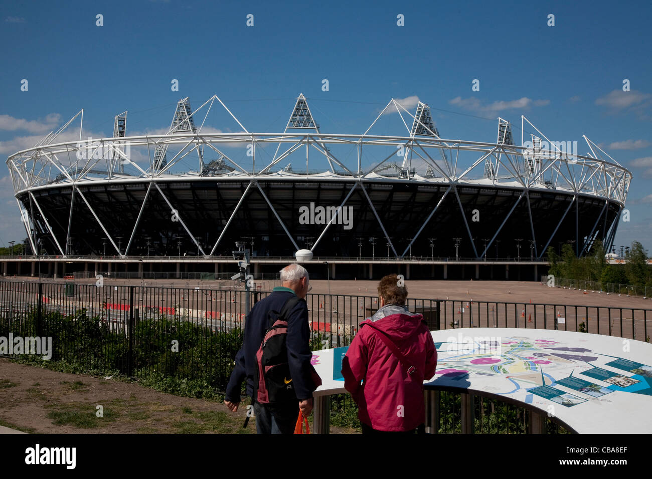 02.05.2011 Preview images for the London 2012 Olympic games. Tourists study a large map of the Olympic Village, with the main St Stock Photo