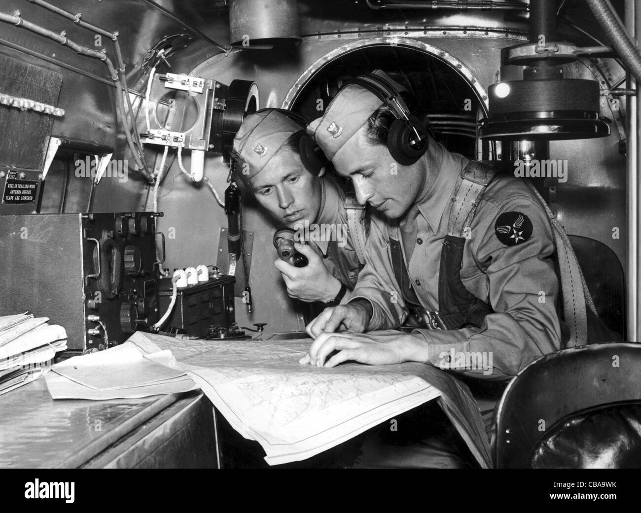 Two American trainee USAAF navigators undergo in flight training during WW11 Stock Photo