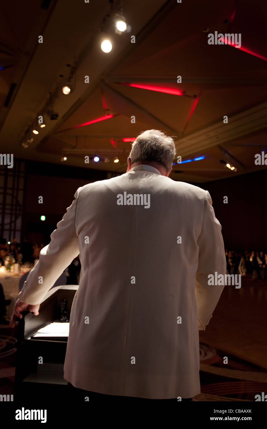 Master of ceremonies, MC, compere,  at an evening function, Japan. Stock Photo