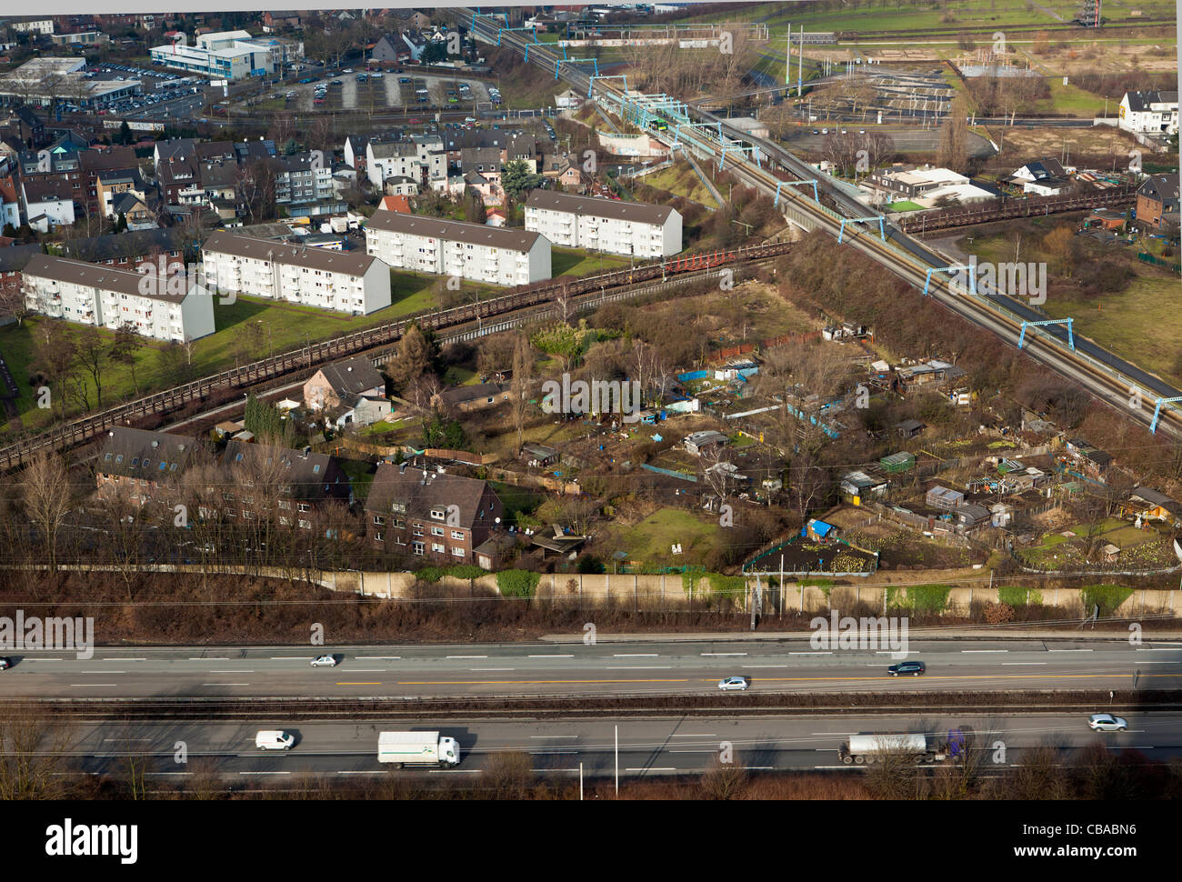 Motorway and train transport and housing in the Rhine Valley near Bochum in the Ruhr area of North Rhine-Westphalia, Germany Stock Photo