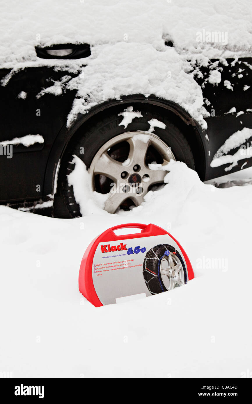 An illustrative photo of snow chains prepared to be mounted on the tire