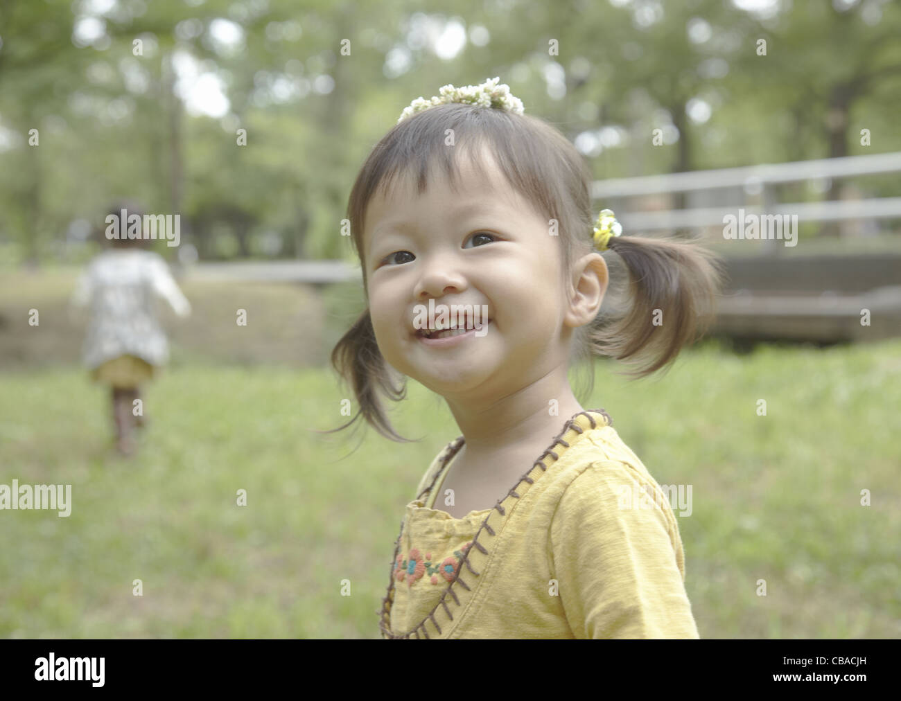 Girl with garland on her head Stock Photo Alamy