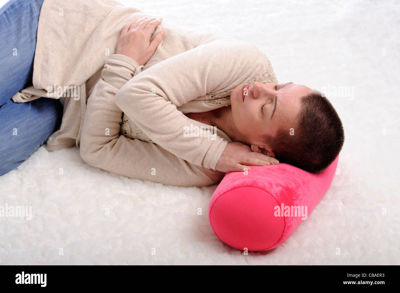 woman sleeping on a carpet Stock Photo Alamy