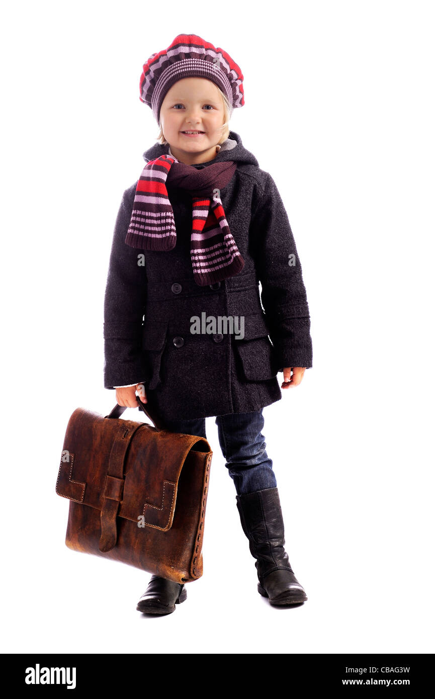 little girl with old weathered schoolbag. isolated on white background Stock Photo
