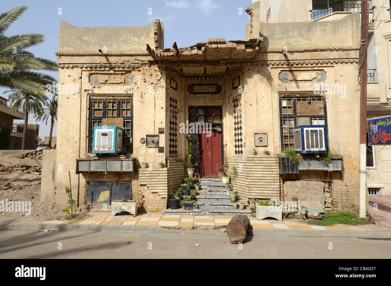 An old house with marks of combat, Baghdad, Iraq Stock Photo