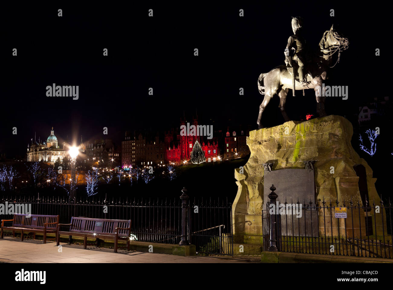Floodlit memorial statue to Royal Scots Greys and Edinburgh Mound at night Scotland UK Europe Stock Photo
