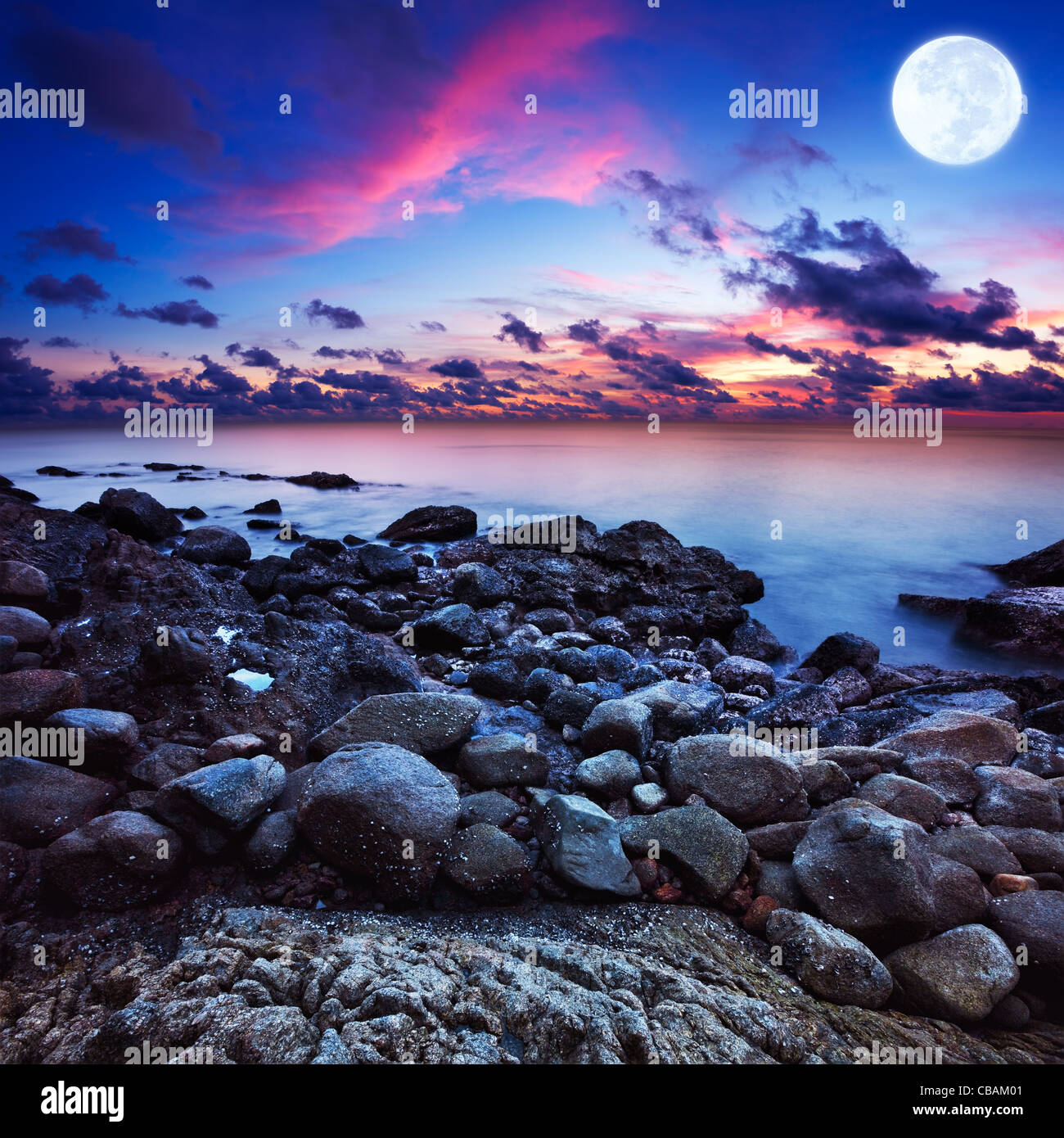 Full moon fantasy seascape. Long exposue shot, square composition. Stock Photo