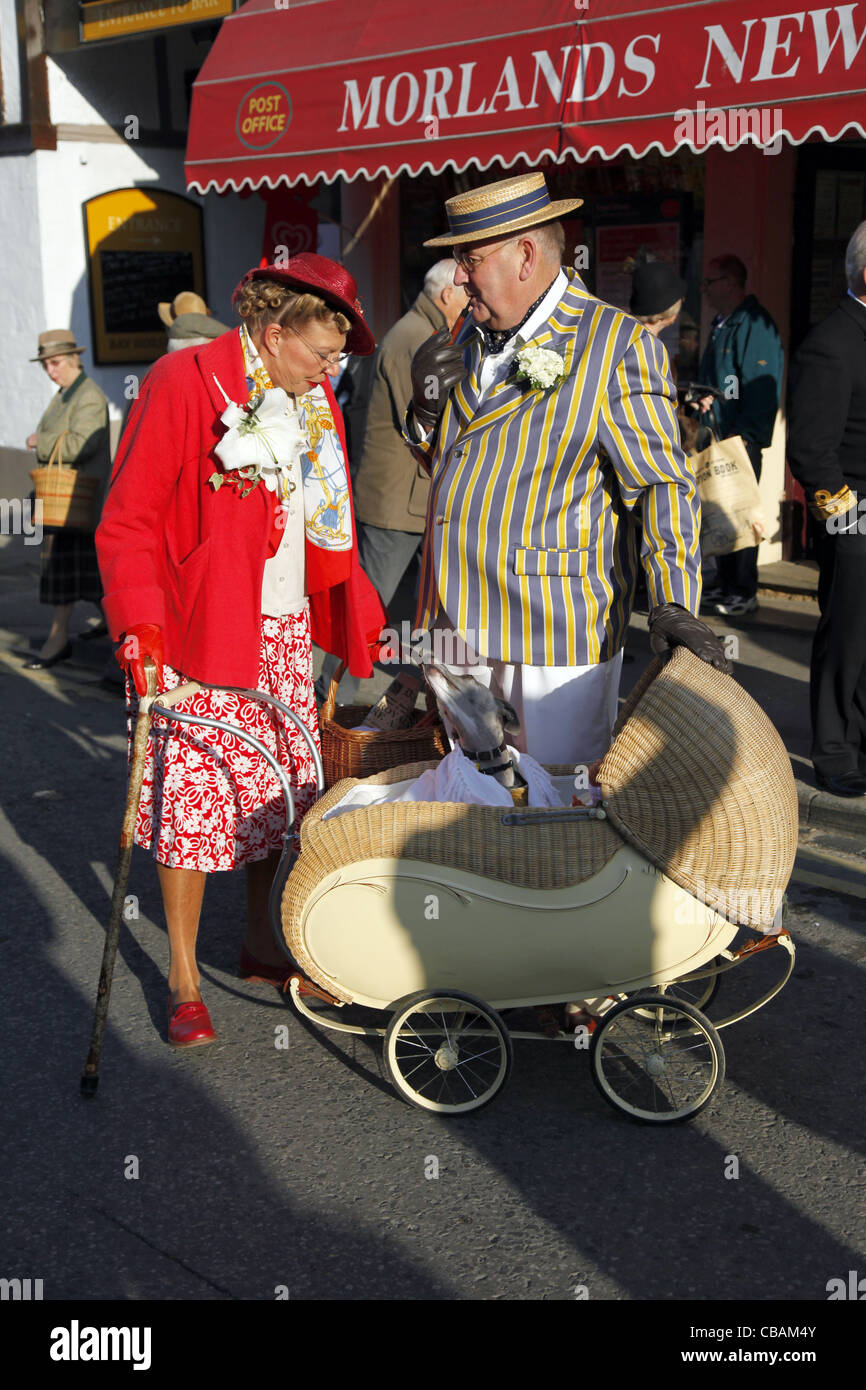 COUNTRY LADY & GENTLEMAN WITH WHIPPET IN PRAM PICKERING NORTH YORKSHIRE 15 October 2011 Stock Photo