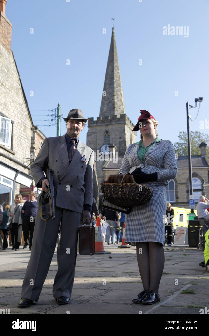 1940S DRESSED MAN & WOMAN PICKERING NORTH YORKSHIRE 15 October 2011 Stock Photo