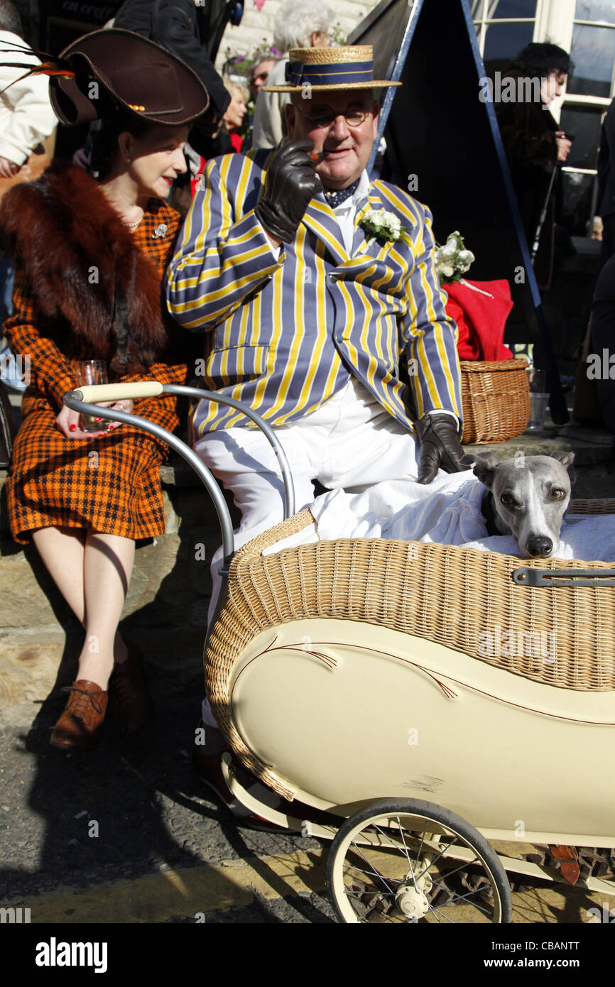 COUNTRY LADY & GENTLEMAN WITH WHIPPET IN PRAM PICKERING NORTH YORKSHIRE 15 October 2011 Stock Photo