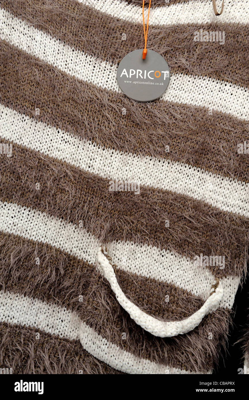 Apricot woolen clothing with logo on a tag england uk Stock Photo