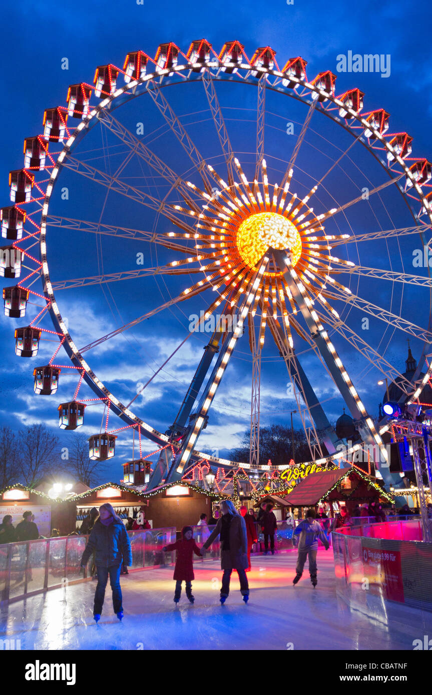 Traditional Christmas market with funfair and ice rink at