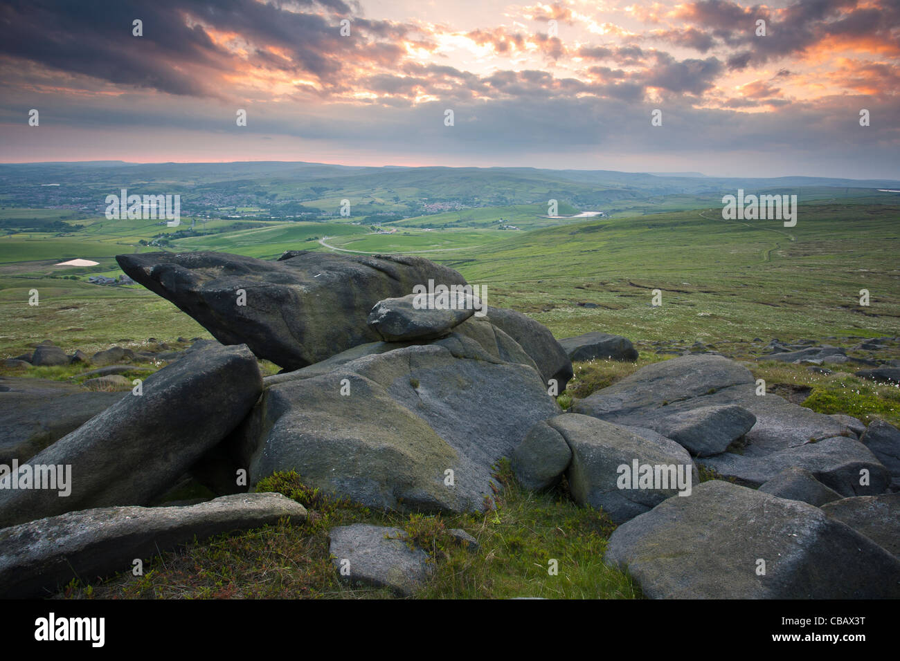 View towards the town of Littleborough at sunset from Blackstone Edge in The Southern Pennines, West Yorkshire, UK Stock Photo