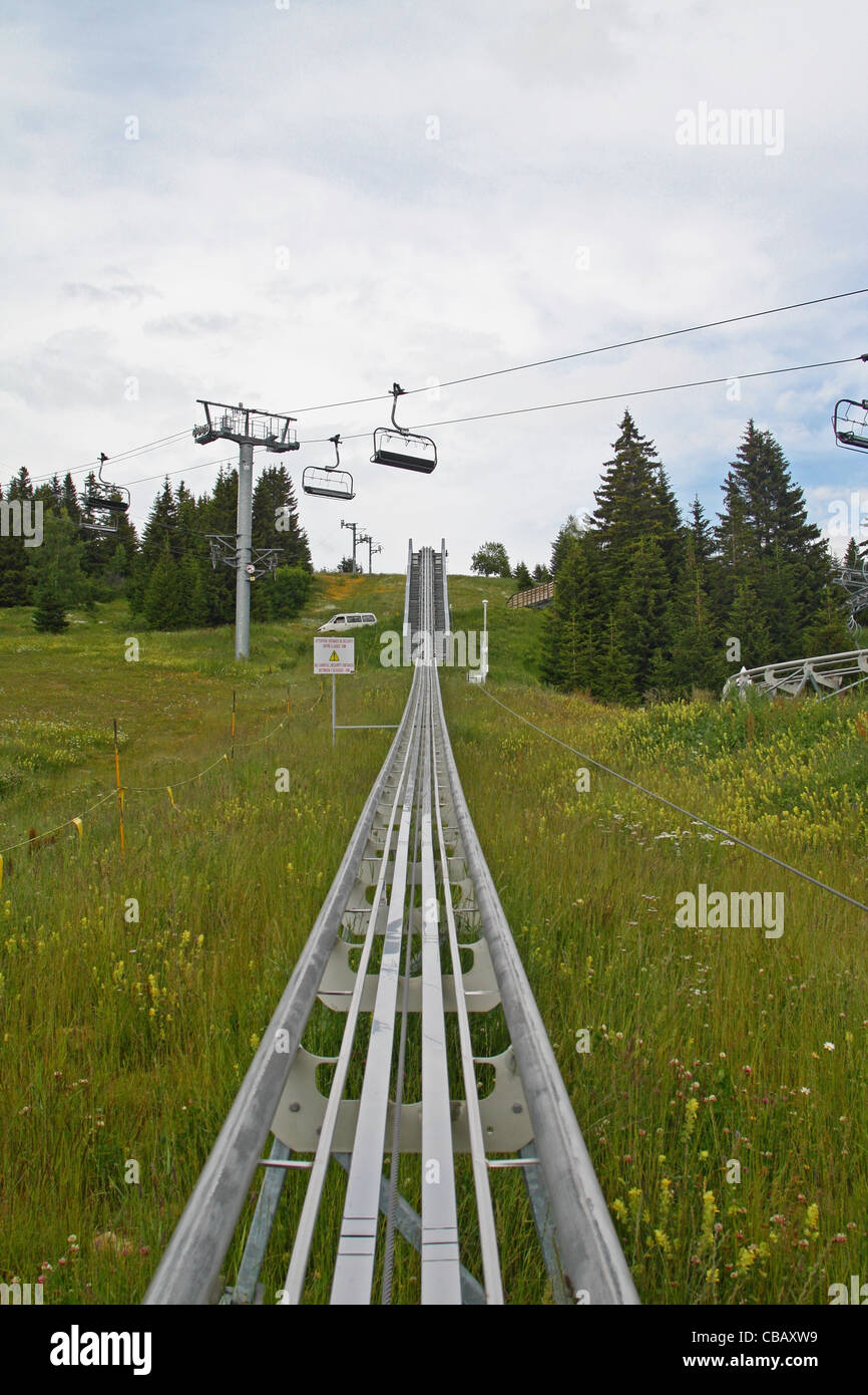 Les Saisies, Savoie (Savoy), France, French Alps. Summer luge (luge d'ete) and ski lift Stock Photo