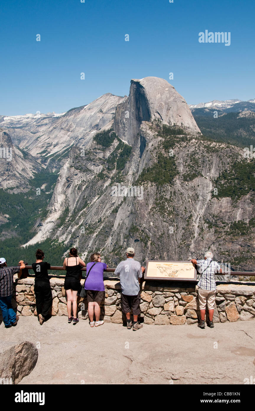 Tourists and Half Dome from Glacier Point granite stone Yosemite National Park California Stock Photo