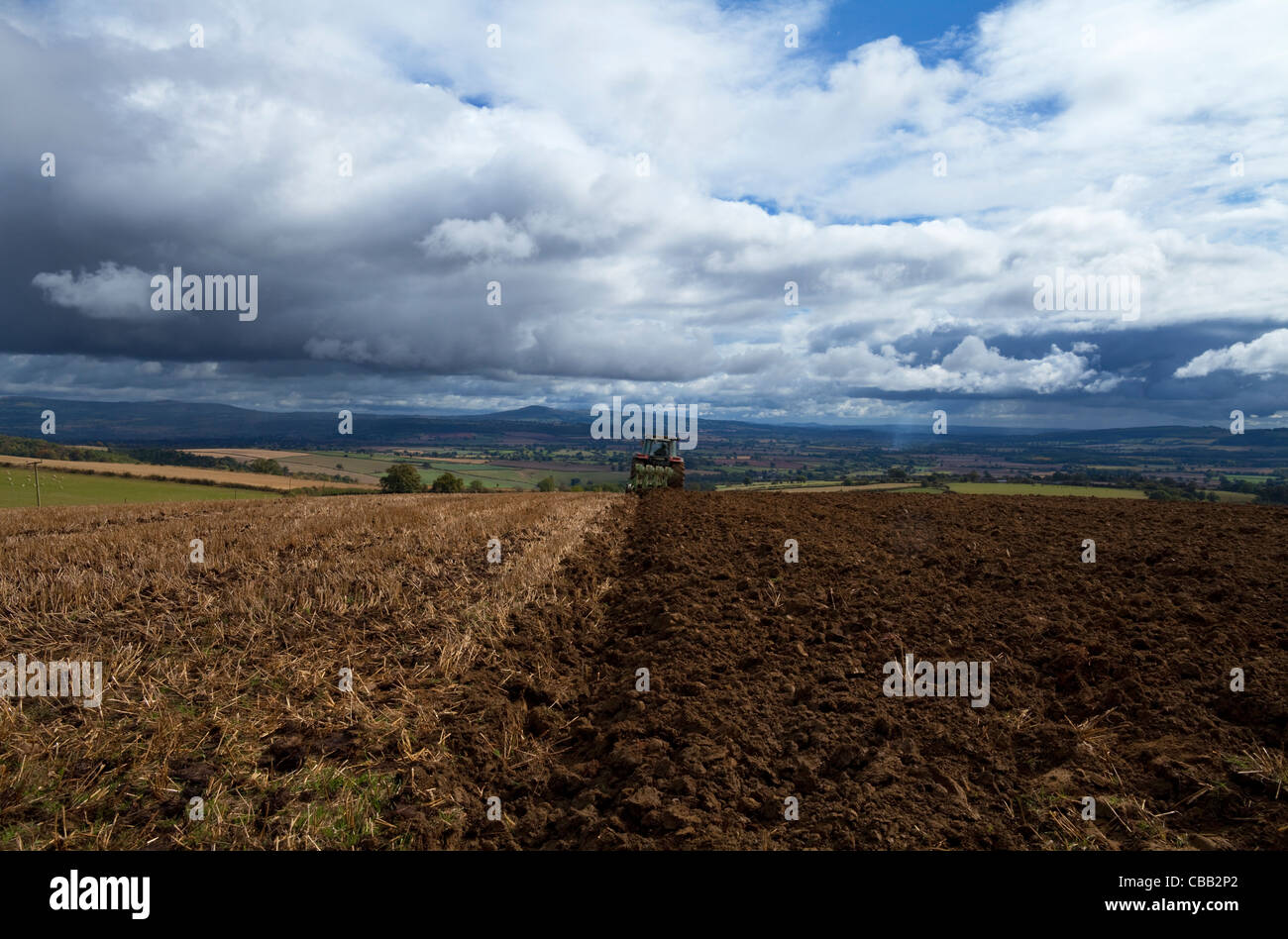 Tillage, Tractor ploughing near Craven Arms, Shropshire, England, UK Stock Photo