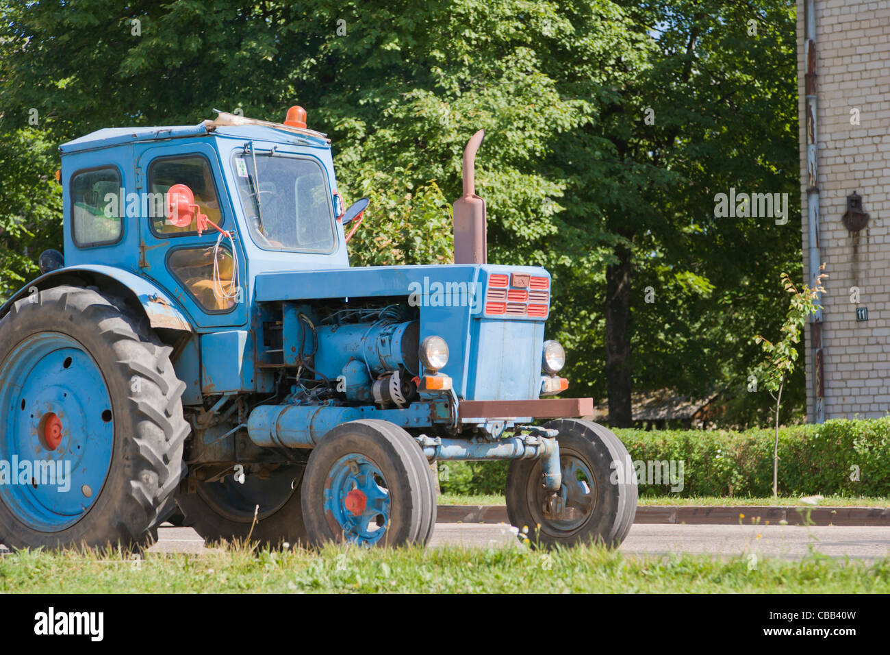 Old Soviet Russian tractor on the street of Dagda, Kraslava District, Latgale, Latvia Stock Photo