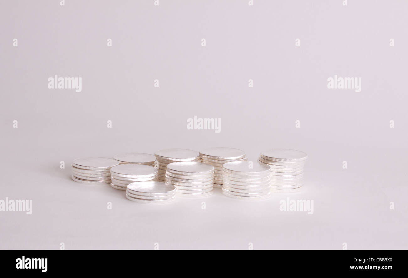 Silver Round Size Stacks of silver rounds Stock Photo - Alamy