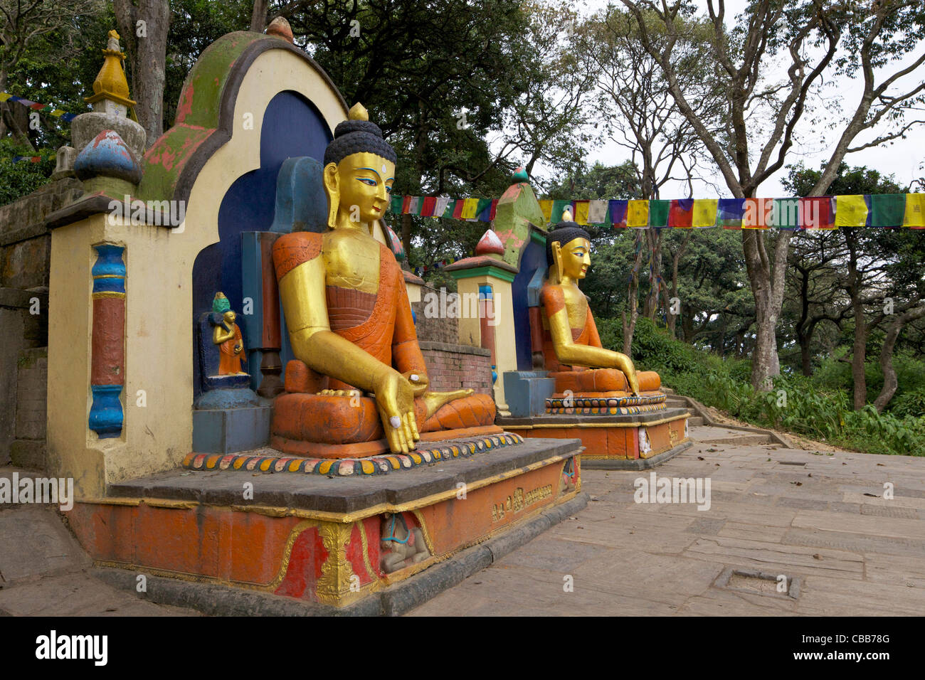 Two seated buddha statues, entrance to Swayambhunath Stupa, Monkey