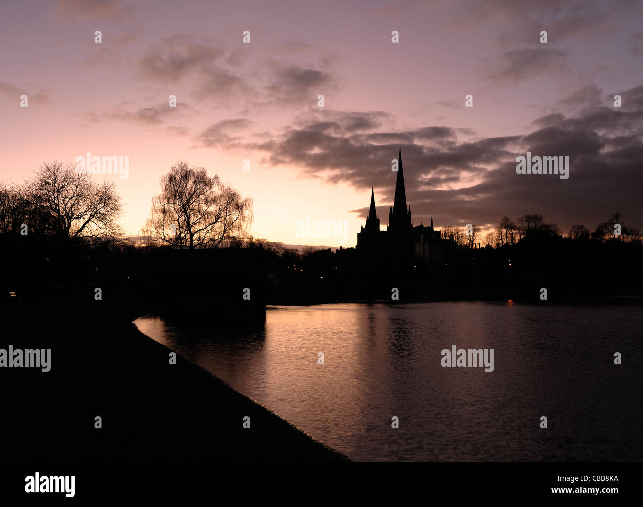 Lichfield Cathedral reflected in Stowe Pool at dusk Stock Photo