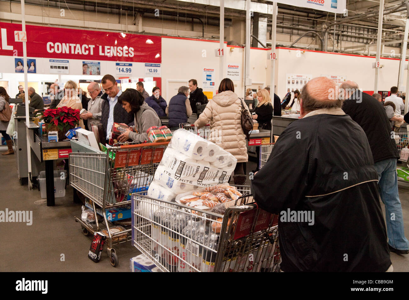 People at the checkout tills, Costco discount warehouse store, Intu Lakeside UK Stock Photo