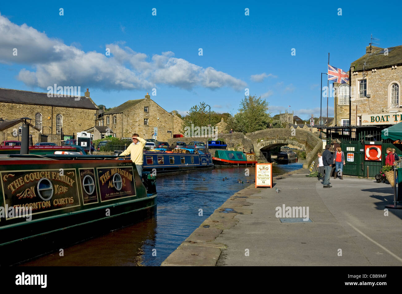 Narrow boats boat moored in the canal basin Skipton North Yorkshire Dales National Park England UK United Kingdom GB Great Britain Stock Photo