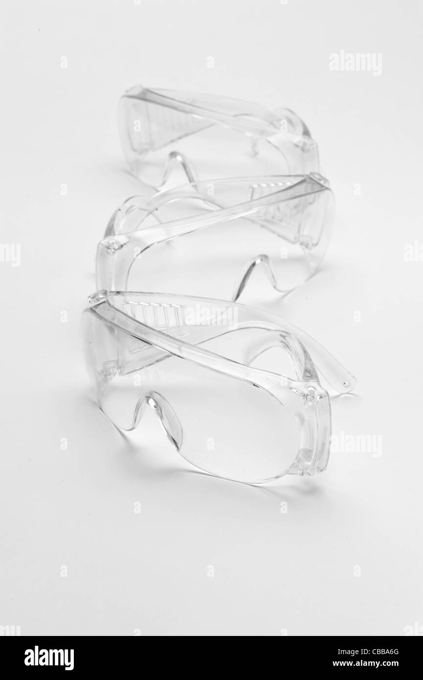 Three pairs of safety goggles Stock Photo