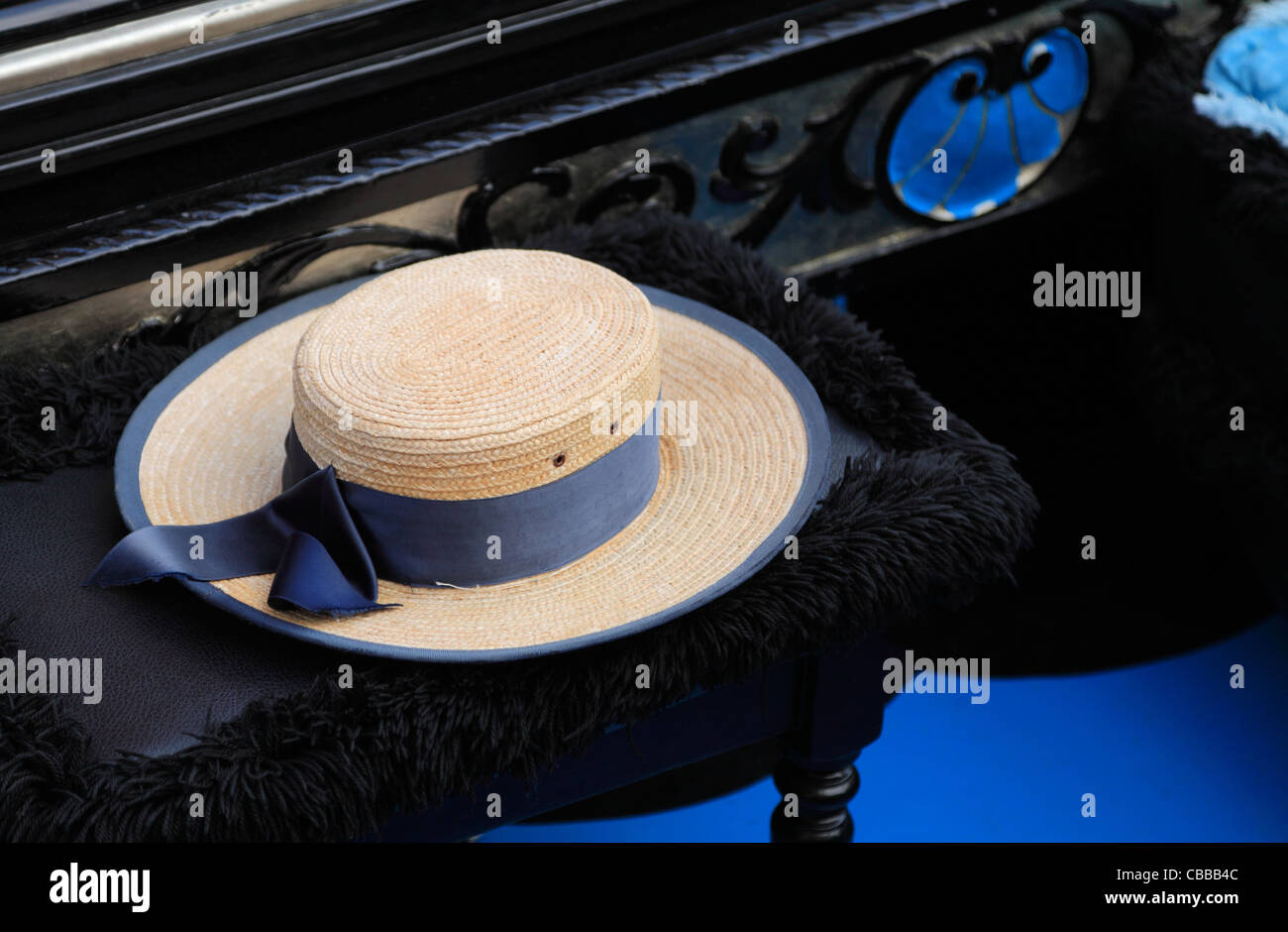Image of a hat of a gondolier on a specific chair in a gondola. Stock Photo