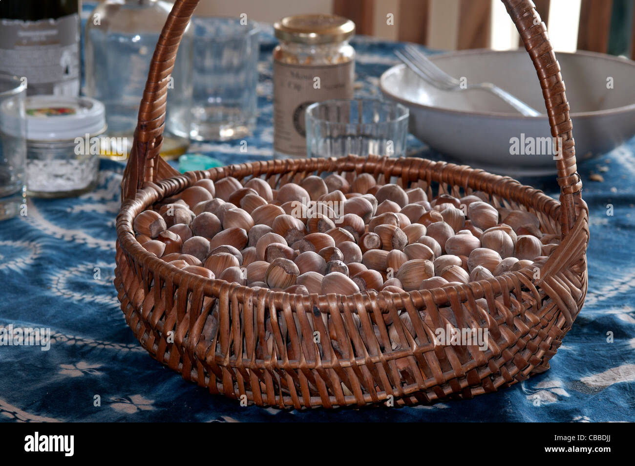 Basket full of hazelnuts on the table Stock Photo