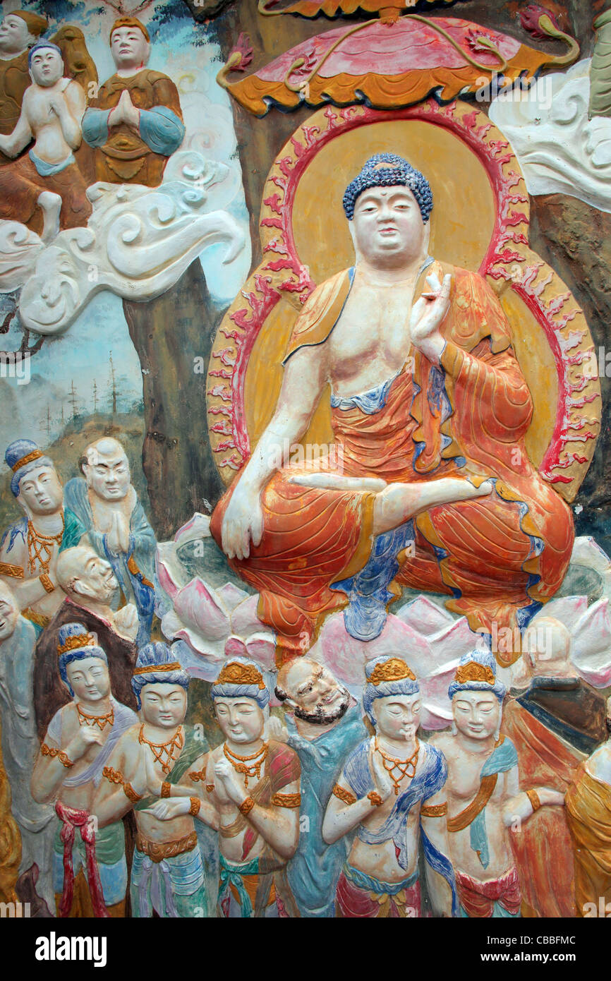 Wall relief sculpture of Buddha and monks inside Kek Lok Si Temple ...