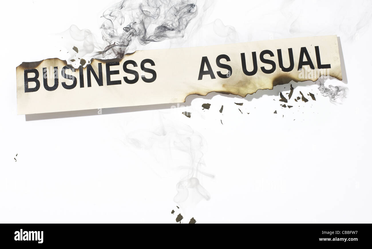 Business as usual sign on fire Stock Photo