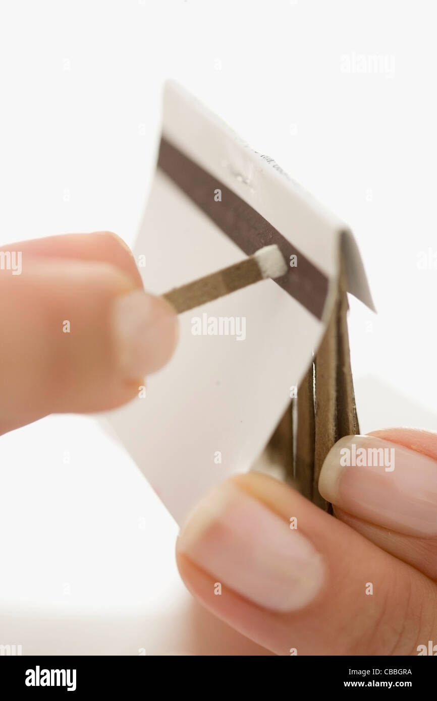 Close up of woman striking match Stock Photo Alamy