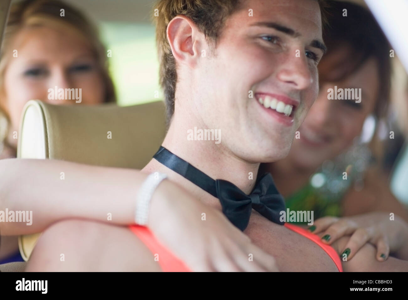 Teenage boy in bow tie and suspenders Stock Photo Alamy