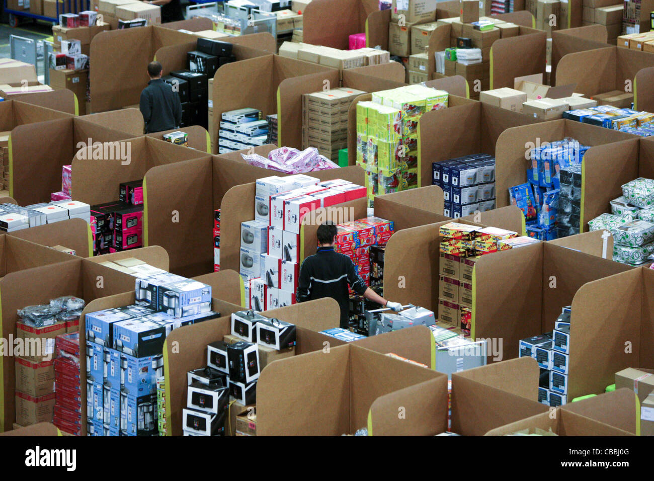 WORKERS SORTING CHRISTMAS PRESENTS AT THE AMAZON WAREHOUSE IN MILTON