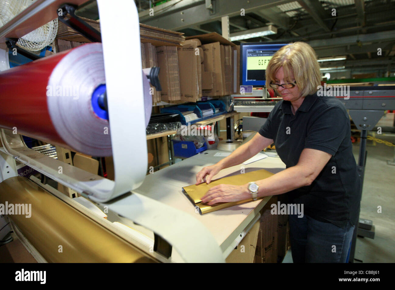 WORKERS SORTING CHRISTMAS PRESENTS AT THE AMAZON WAREHOUSE IN MILTON