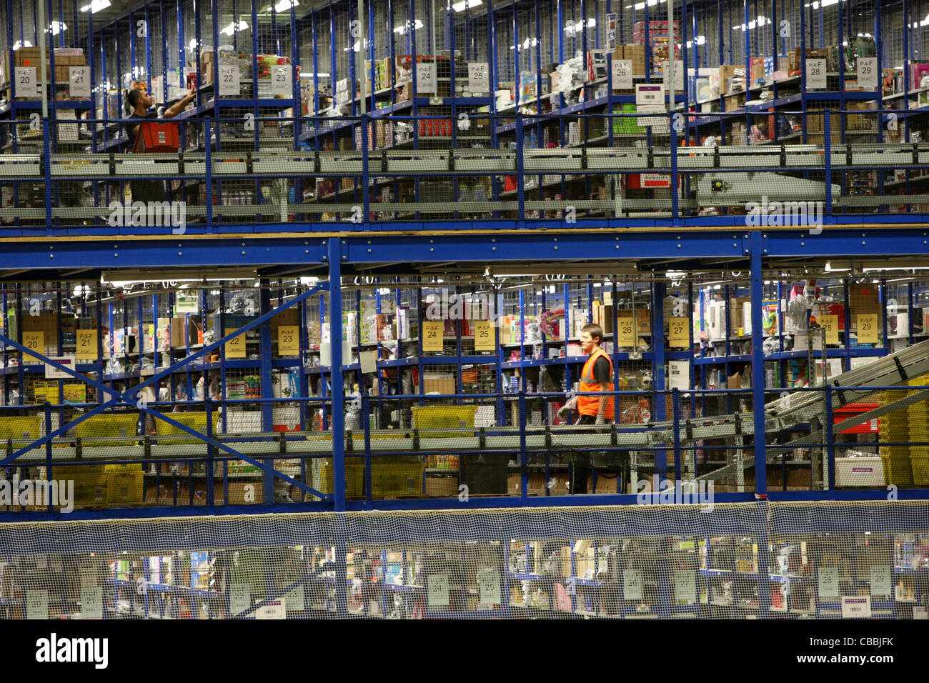 WORKERS SORTING CHRISTMAS PRESENTS AT THE AMAZON WAREHOUSE IN MILTON