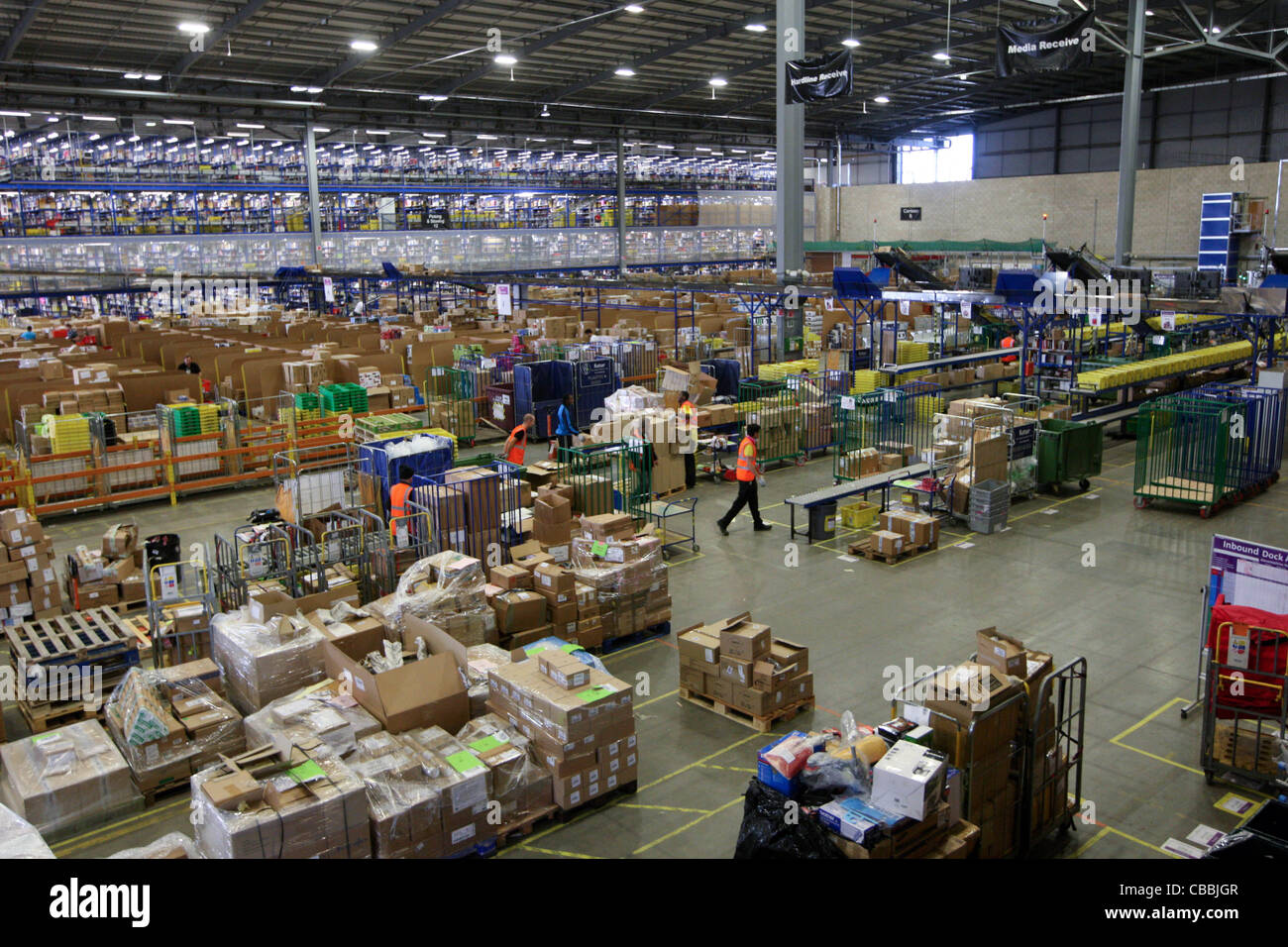 WORKERS SORTING CHRISTMAS PRESENTS AT THE AMAZON WAREHOUSE IN MILTON