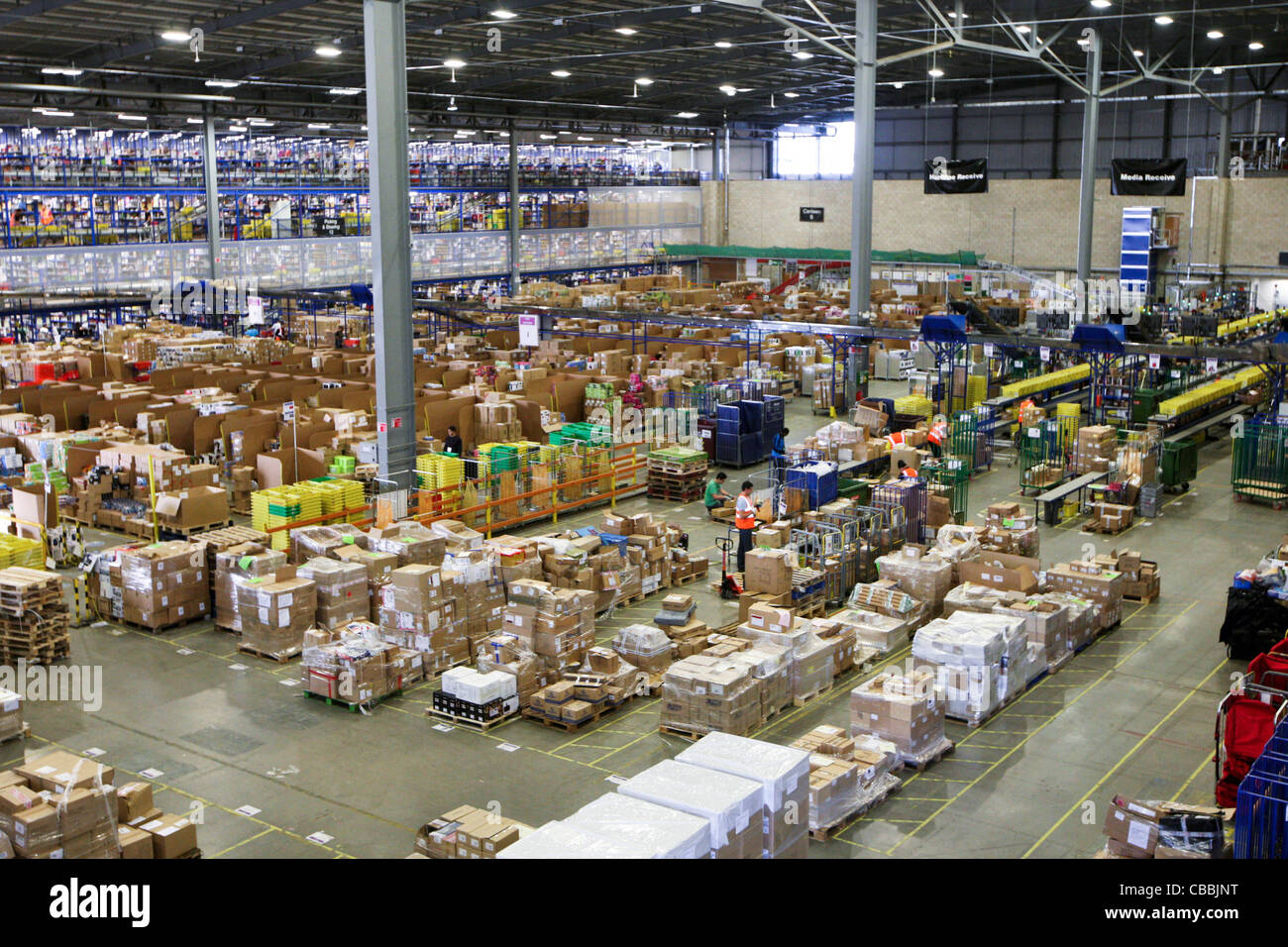 WORKERS SORTING CHRISTMAS PRESENTS AT THE AMAZON WAREHOUSE IN MILTON