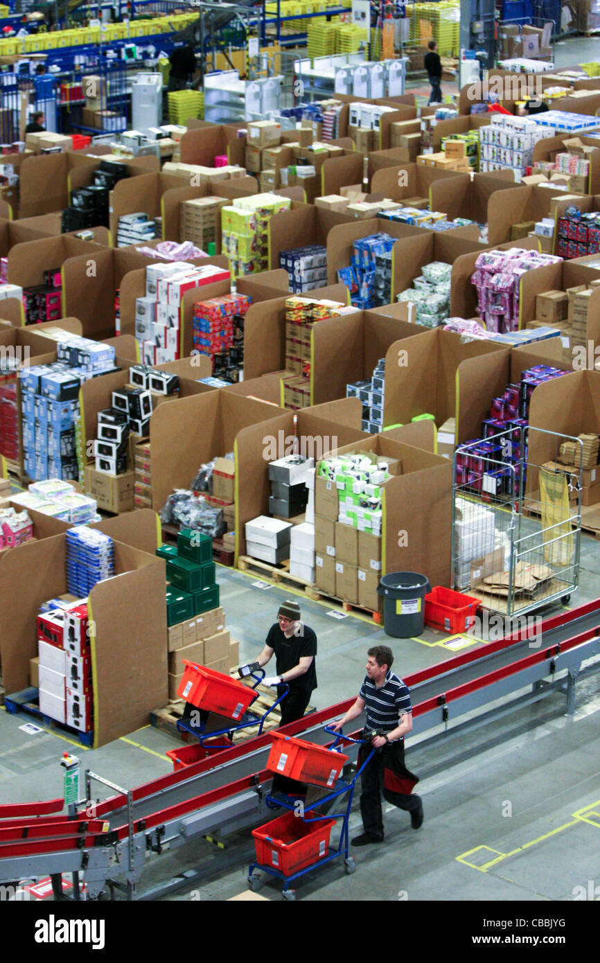 WORKERS SORTING CHRISTMAS PRESENTS AT THE AMAZON WAREHOUSE IN MILTON