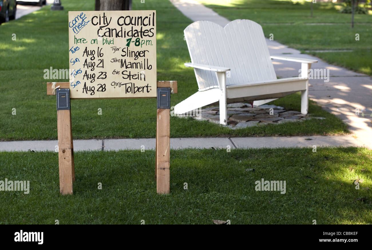 Yard sign with a list of dates to meet candidates running for public office Stock Photo