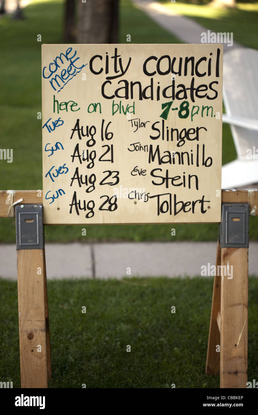 Yard sign with a list of dates to meet candidates running for public office Stock Photo